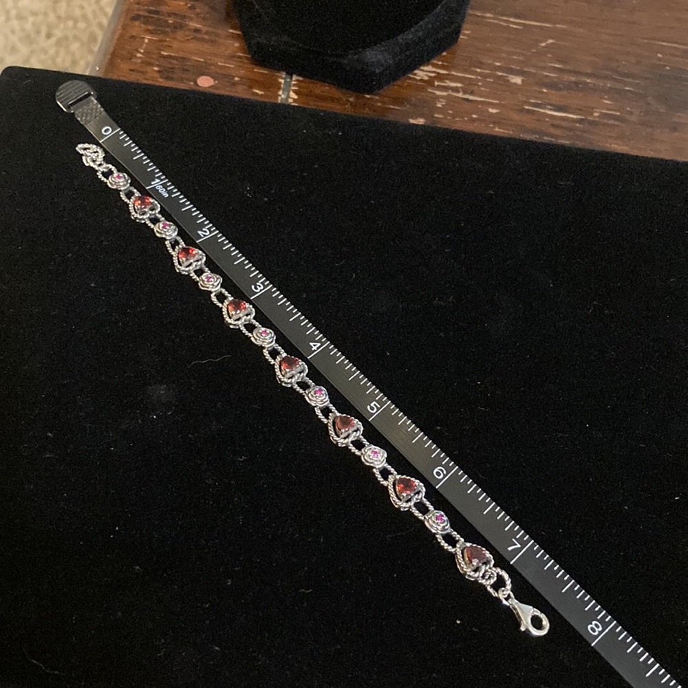 Gorgeous Sterling silver bracelet surrounded by lab created rubies and garnets - Picture 2 of 7
